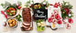 © bit24 - Delicious Christmas themed dinner table with roasted meat, appetizers and desserts. Holiday concept.