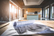 © SnapVault - The blueprints of a residence on a worktable during the renovation, construction in progress.