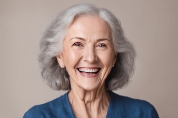 Beautiful gorgeous 50s mid age beautiful elderly senior model woman with grey hair laughing and smiling. Mature old lady close up portrait. Healthy face skin care beauty, skincare cosmetics, dental.