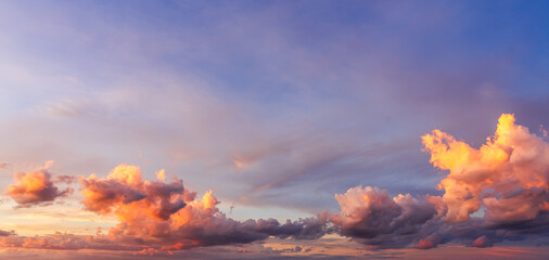 colorful clouds sky in the evening with red, orange sunshine and blue sky horizon background