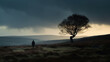 Lonely person walking on scenic valley landscape with solitary tree and endless rolling hills