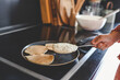 © shine.graphics - Cooking breakfast, pancakes in a pan