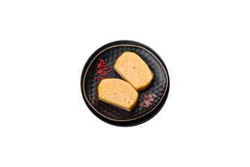 Delicious porous yellow cheese cut in large pieces on a ceramic plate