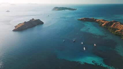 Wall Mural - Aerial view of the Komodo National Park. Live aboard boats anchored in the clam bay of the Komodo National Park in Indonesia