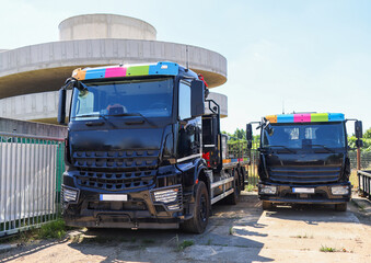 two trucks staying in the truck parking. 