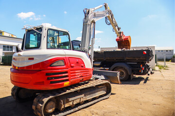 The excavator works with a truck