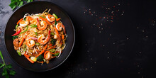 Overhead Perspective Of Shrimp And Vegetable Stir-Fry Presented On A Black Slate Background.