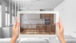 Augmented reality concept. Hand holding tablet with AR application used to simulate furniture and design products in total white background, minimal kitchen with island and chairs