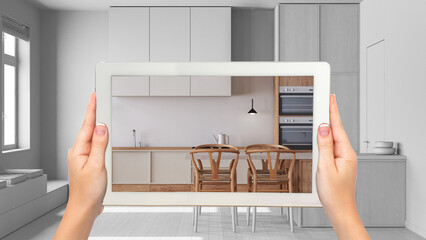 Wall Mural - augmented reality concept. hand holding tablet with ar application used to simulate furniture and de