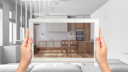 Wall Mural - augmented reality concept. hand holding tablet with ar application used to simulate furniture and de