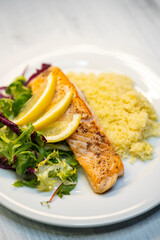 Canvas Print - salmon fillet with couscous and vegetables salad