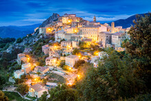 Ancient Mountain Village Of Speloncato In Evening Lights In The Balagne Region Of Corsica Island, France