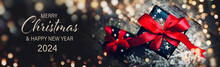 Christmas Card - Merry Christmas And Happy New Year 2024 - Beautiful Gift Box And Golden Bokeh Lights