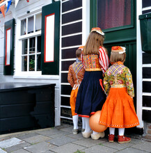 At King’s Day People At Marken Are Dressed In Traditional Costume