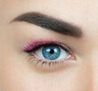 © Marina - Macro shot of female blue eye with 2d 3d 4d volume long false lashes. Young woman with perfect eyes and beautiful black and pink colored eyelash extensions. Closeup beauty photo of lash extension