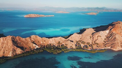 Poster - Aerial view of the part of Komodo National Park in Indonesia. Aerial view of the island and lagoon with turquoise water