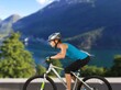 © BillionPhotos.com - Fit sporty female cyclist riding on the road