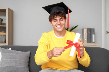 Poster - Male graduate student with diploma video chatting at home