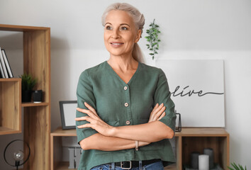 Wall Mural - Mature woman smiling at home