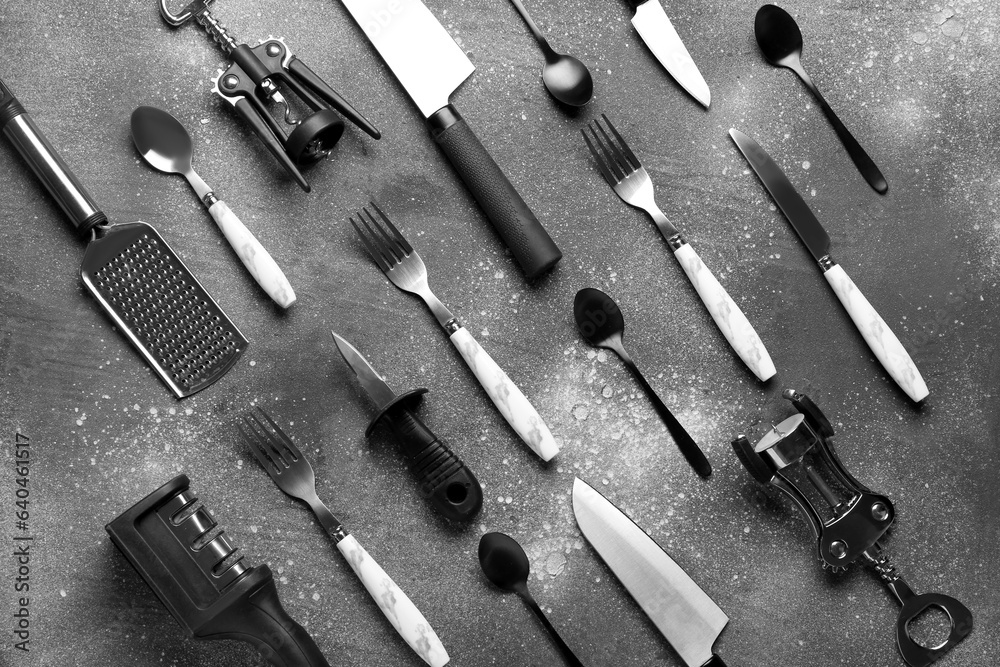 Different kitchen utensils on grey background
