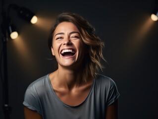 A woman laughing in front of three spotlights. Generative AI.