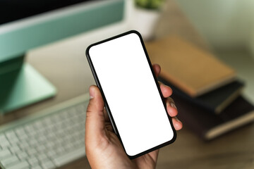 Poster - businessman holding a blank screen smartphone mobile with blank screen blank for your advertising text message communication background workplace job copy space