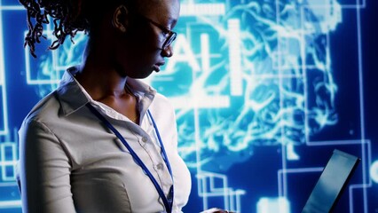 Portrait of smiling african american developer programming scripts on laptop, employing AI machine learning, manipulating lines of code for artificial intelligence applications computing