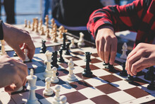 Chess Tournament, Kids And Adults Participate In Chess Match Game Outdoors In A Summer Sunny Day, Players Of All Ages Play, Competition In Chess School Club With Chessboards On A Table