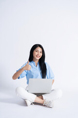 Wall Mural - Photo of young Asian girl on white background