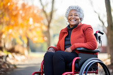Elderly Black Female Lady Sitting In A Wheel Chair In A Urban Park.
