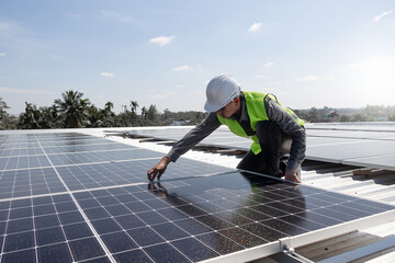 A technician installing the solar panels at roof top of home and home office ,concept of economic energy and cost saving ,own small business