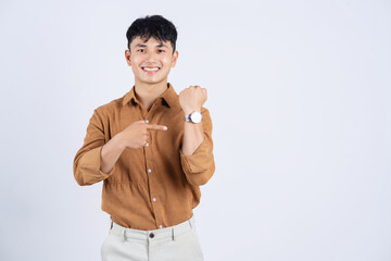 Wall Mural - Photo of young Asian businessman on white background