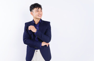 Wall Mural - Photo of young Asian businessman on white background