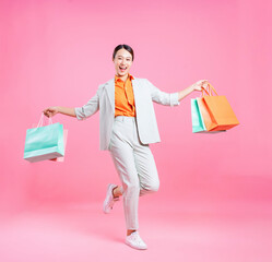 Wall Mural - Photo of young Asian businesswoman on background