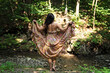 © photosbysabkapl - A woman backwards in a long dress walking in the forest feels freedom, happiness and relax. Beautiful posing, sexy and girl among nature.