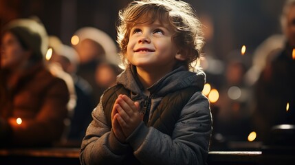 Small boy praying in the church