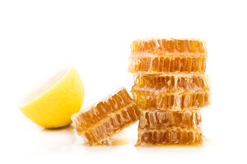 Wall Mural - sweet honeycombs with lemon isolated on white background