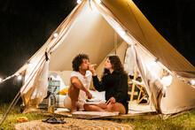 Couple In Love Eating Pizza In A Camping Tent