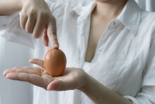 A Person Holding Eggs In Hand