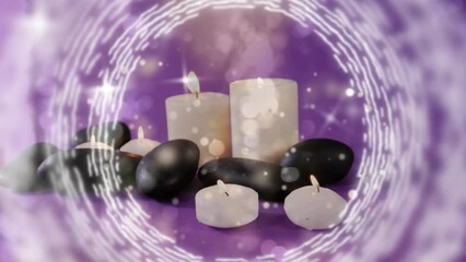 Poster - Animation of white light spots over lit candles and stones