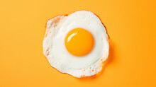 Fried Egg On A Yellow Background. Top View