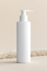 Poster - White cosmetic shampoo dispenser bottle mockup on the soft yellow background.