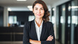 © BlazingDesigns - Confident businesswoman smiling smiling corporate manager, looking at camera with arms crossed.