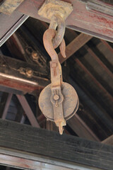 Wall Mural - A Large Ceiling Mounted Industrial Pulley and Hook.