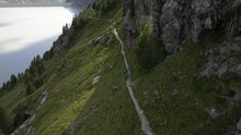 View From Drone Mountain Path For Hiking And Walking In Nature In Valmalenco Valley Italian Alps , Sondrio, Italy ,  Alpe Gera Dam - Sports Couple Run Off Road In The Mountains