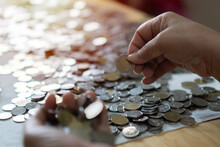 Woman's Hands Full Of Coins And Holding 10 Bath Coin, Business People Saving Money For Future Investment