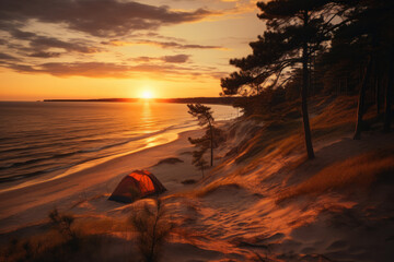 Wall Mural - Colourful tent set in sand dunes on an ocean coast on summer evening. Enjoying scenic views during an overnight hike. Hiking and trekking on a nature trail.