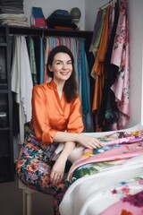 fashion, shopping and happy with a woman designer in the studio for fabric or textile