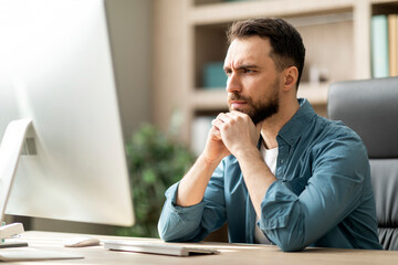 Aufkleber - Focused Businessman Looking At Computer Screen While Working At Desk In Office