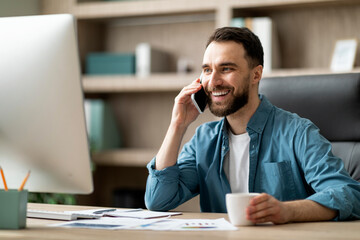 Aufkleber - Mobile Communication. Handsome Male Entrepreneur Talking On Cellphone On Workplace In Office